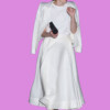 A woman in a white dress and blazer celebrating on a city street, bla bla.
