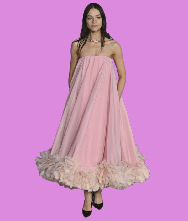 Elegant pink dress worn by a model at a fashion event, bla bla.