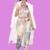 Fashionable woman with curly hair, sunglasses, and a white coat, wearing a colorful patchwork outfit, bla bla.