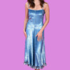 A woman in a shiny blue dress at the London Film Festival, bla bla.